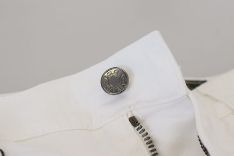 White slim skinny stretch cotton denim jeans by Dolce & Gabbana, showing fitted design and classic five-pocket style.
