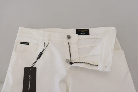 White slim skinny stretch cotton denim jeans by Dolce & Gabbana, showing close-up of fitted design and quality fabric.