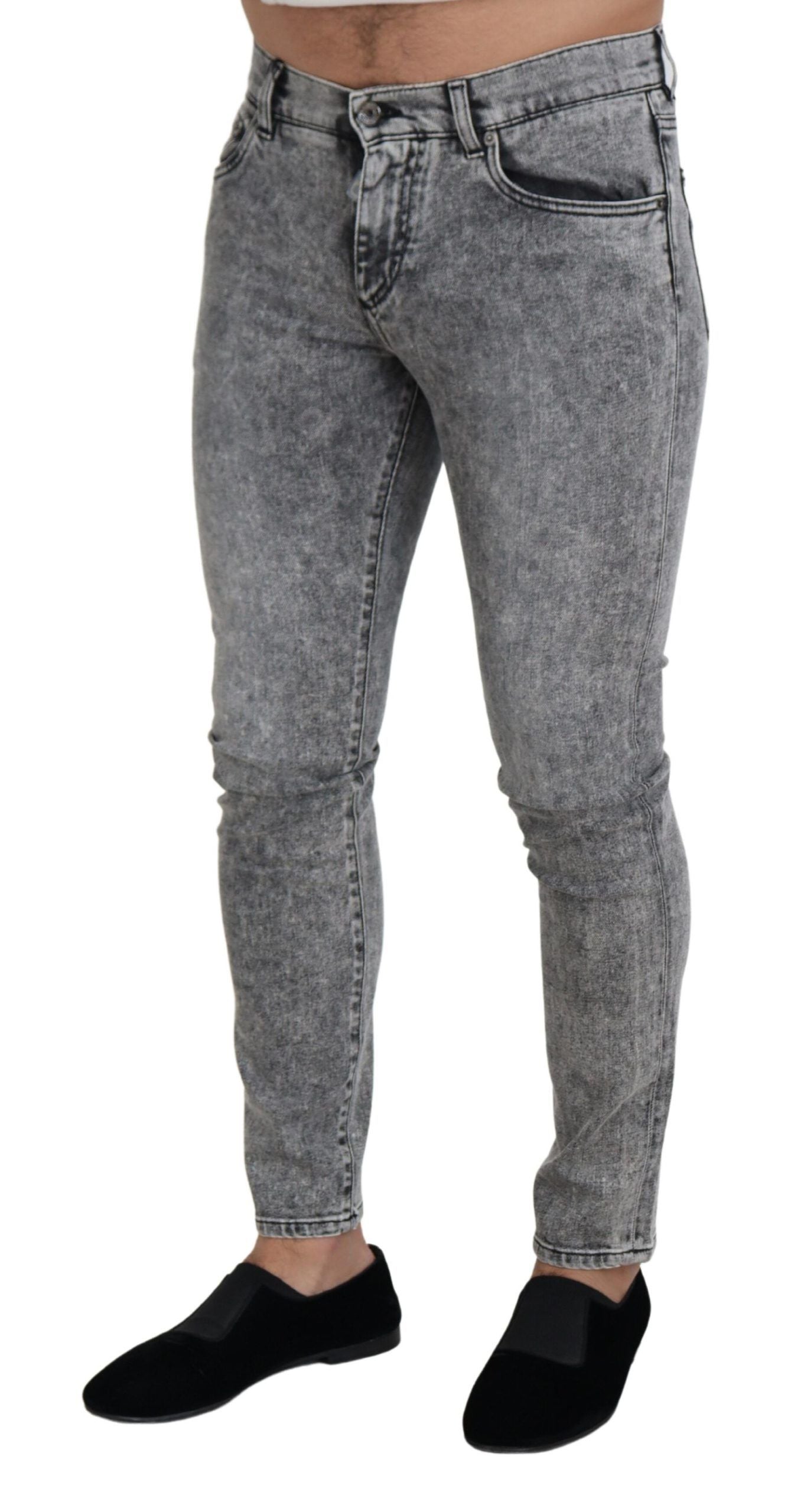 Gray slim fit stretch cotton denim jeans by Dolce & Gabbana, showing close-up of fit and fabric texture.