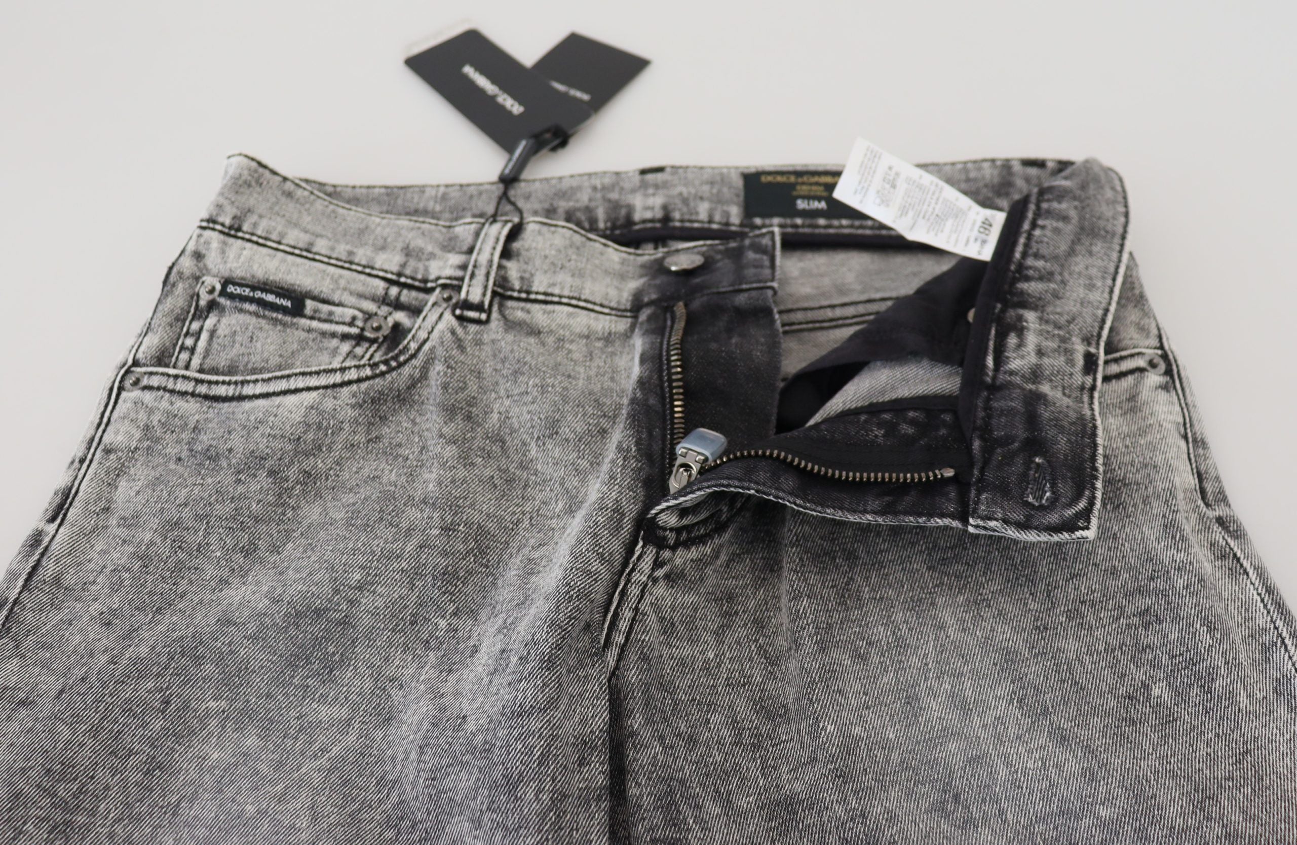 Gray slim fit stretch cotton denim jeans by Dolce & Gabbana, showing the front view with classic five-pocket design.