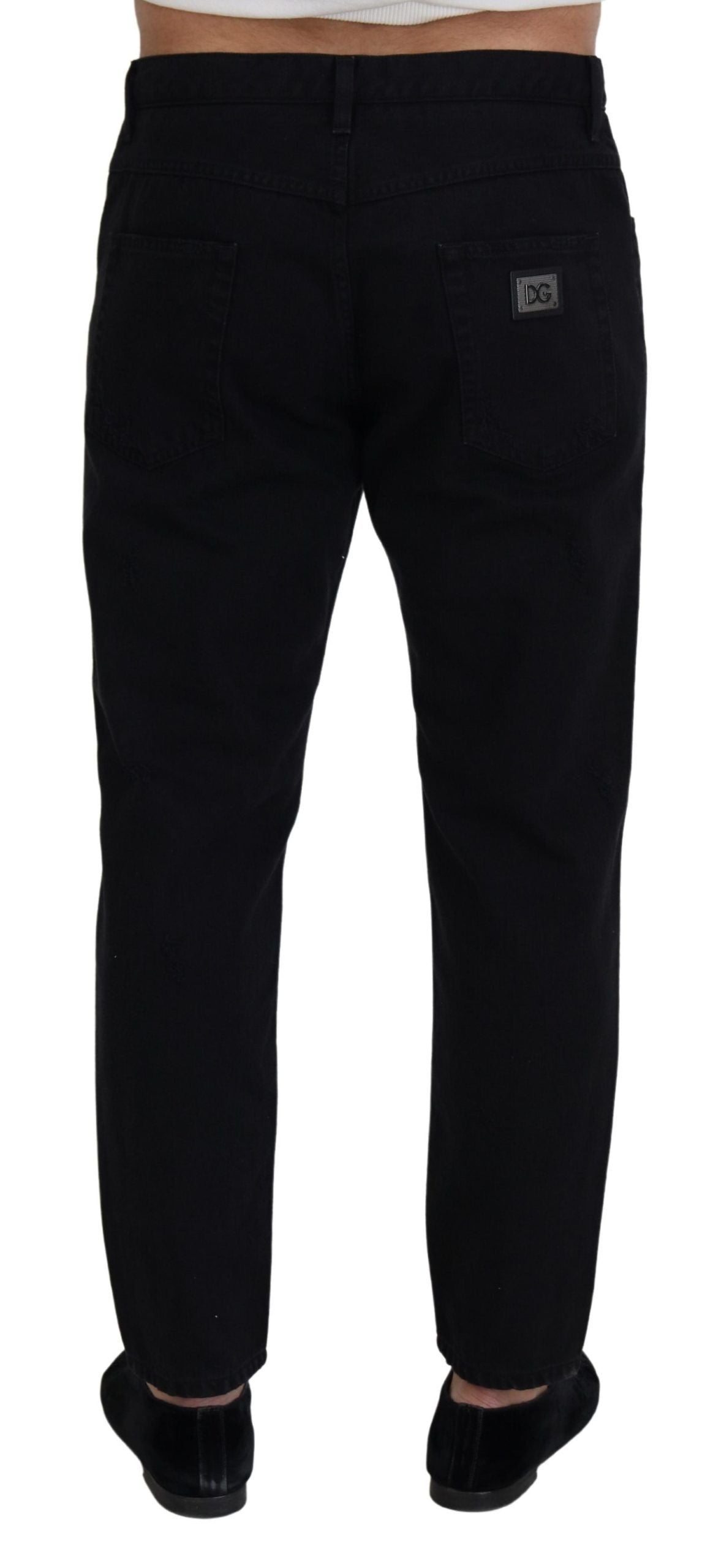 Black loose regular fit torn cotton jeans by Dolce & Gabbana, showcasing distressed details and relaxed style.