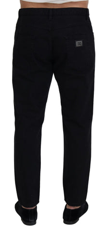 Black loose regular fit torn cotton jeans by Dolce & Gabbana, showcasing distressed details and relaxed style.