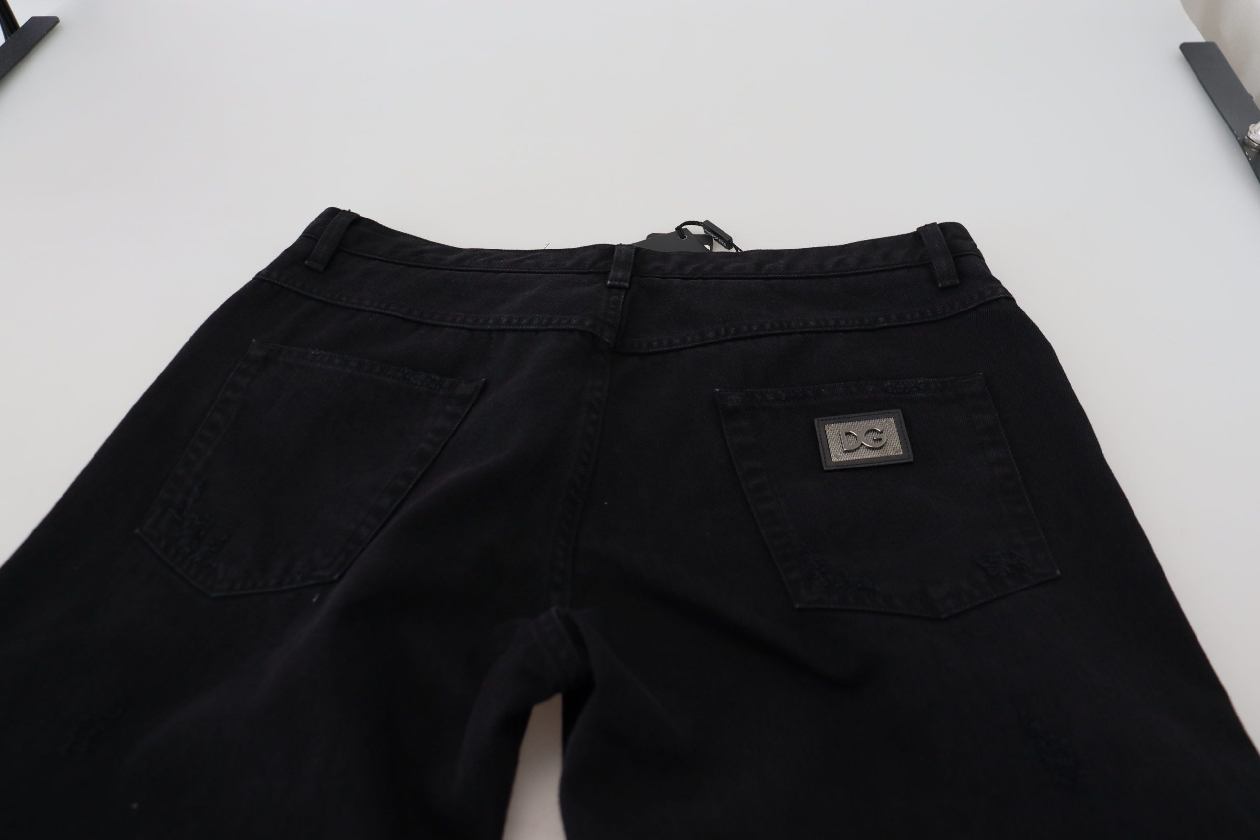 Black loose regular-fit torn cotton jeans by Dolce & Gabbana, showcasing distressed details and relaxed denim style.