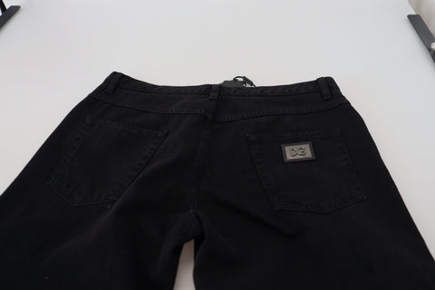 Black loose regular-fit torn cotton jeans by Dolce & Gabbana, showcasing distressed details and relaxed denim style.