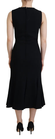 Black Dolce & Gabbana sheath flare viscose dress displayed on a hanger with a fitted silhouette and elegant design.