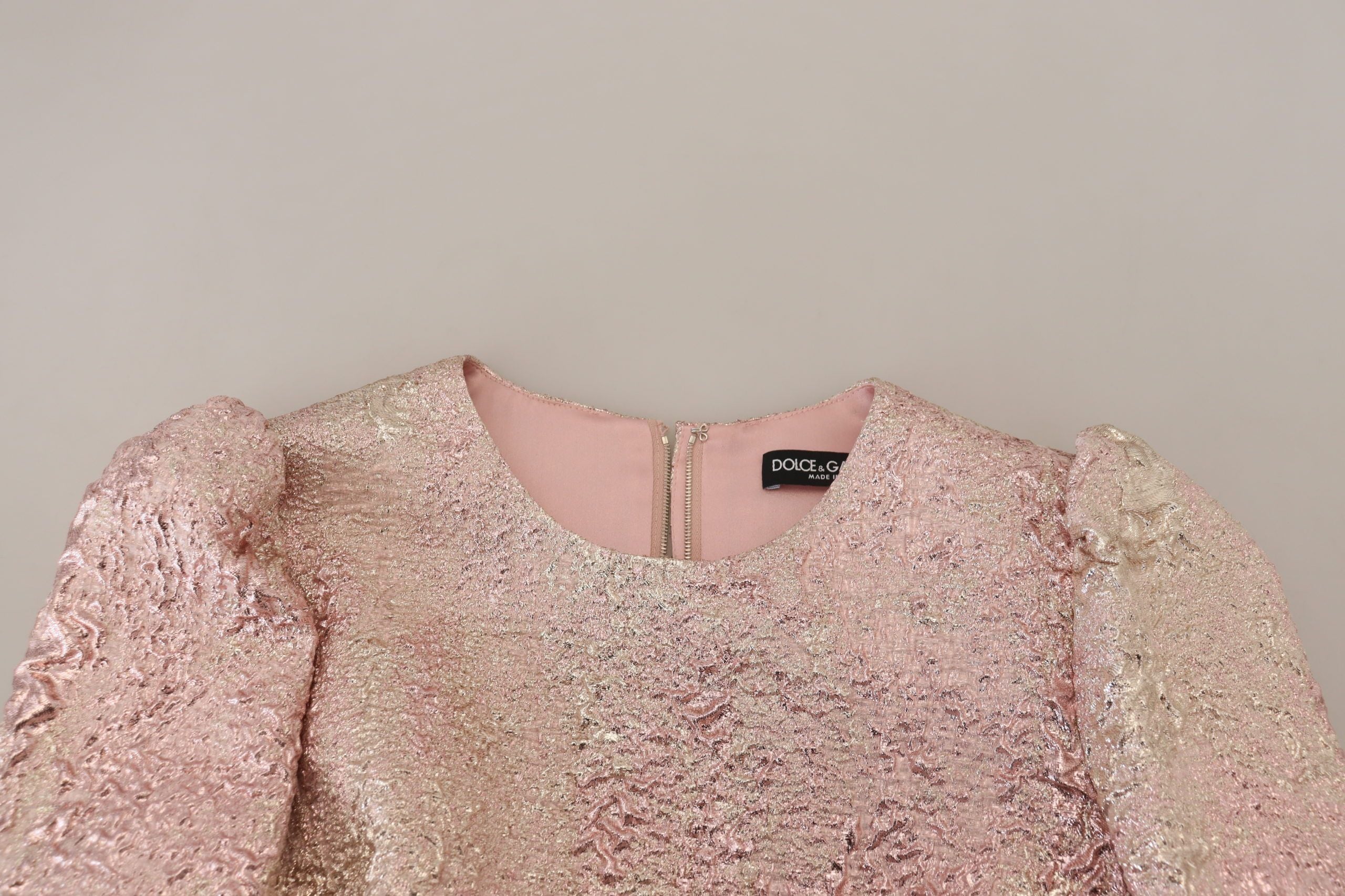 Pink jacquard 3/4 sleeve sheath midi dress by Dolce & Gabbana, featuring a fitted silhouette and elegant floral pattern.