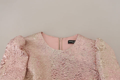 Pink jacquard 3/4 sleeve sheath midi dress by Dolce & Gabbana, featuring a fitted silhouette and elegant floral pattern.