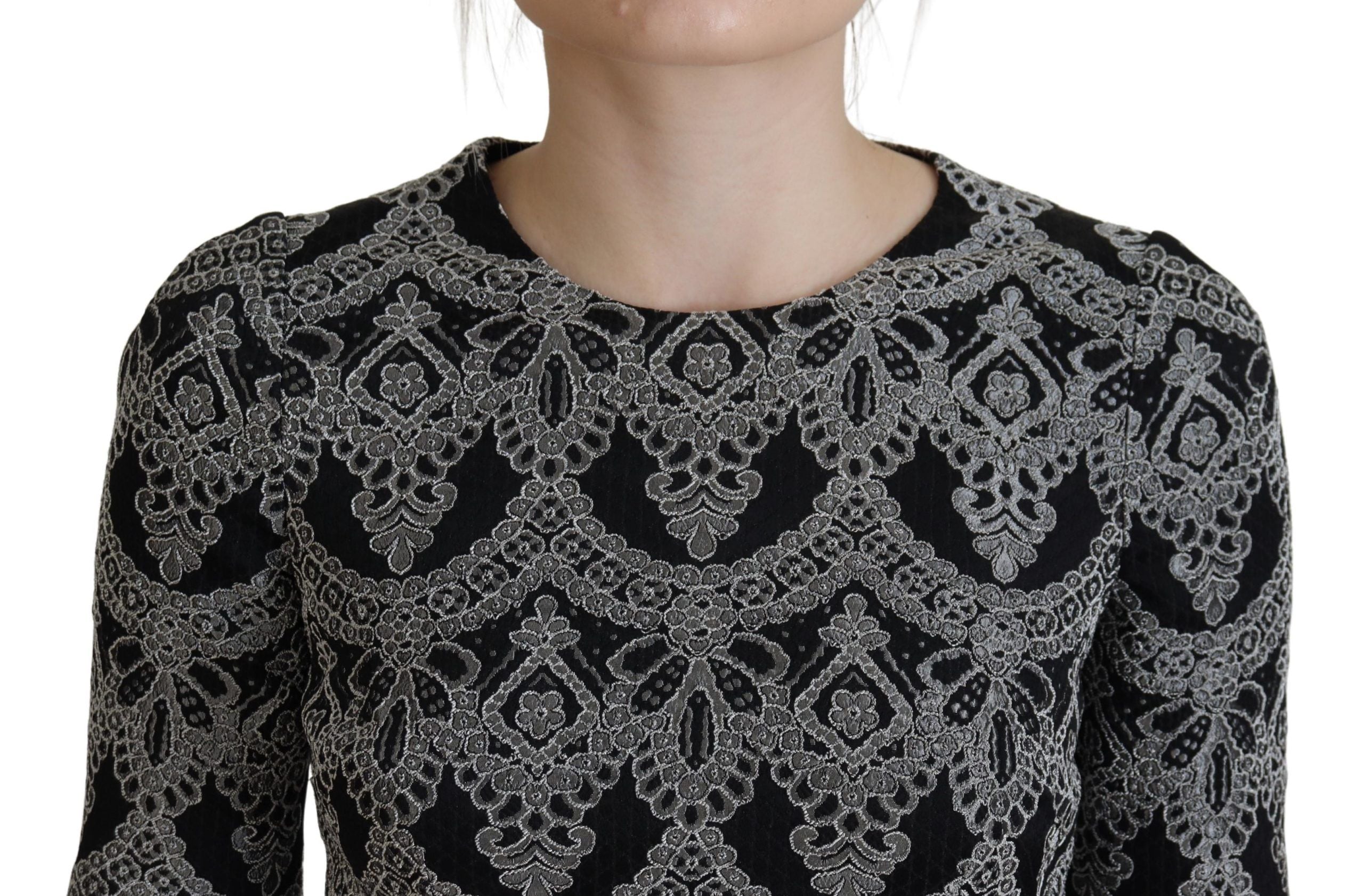 Black and gray jacquard sheath bodycon dress by Dolce & Gabbana, featuring a fitted silhouette and intricate woven pattern.