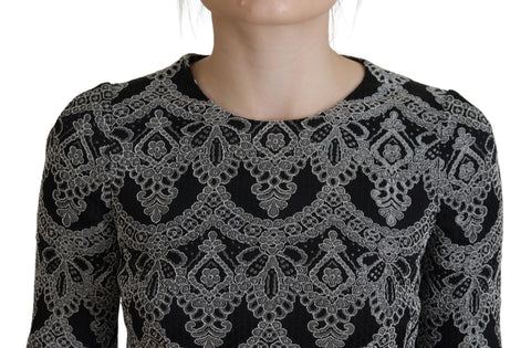 Black and gray jacquard sheath bodycon dress by Dolce & Gabbana, featuring a fitted silhouette and intricate woven pattern.