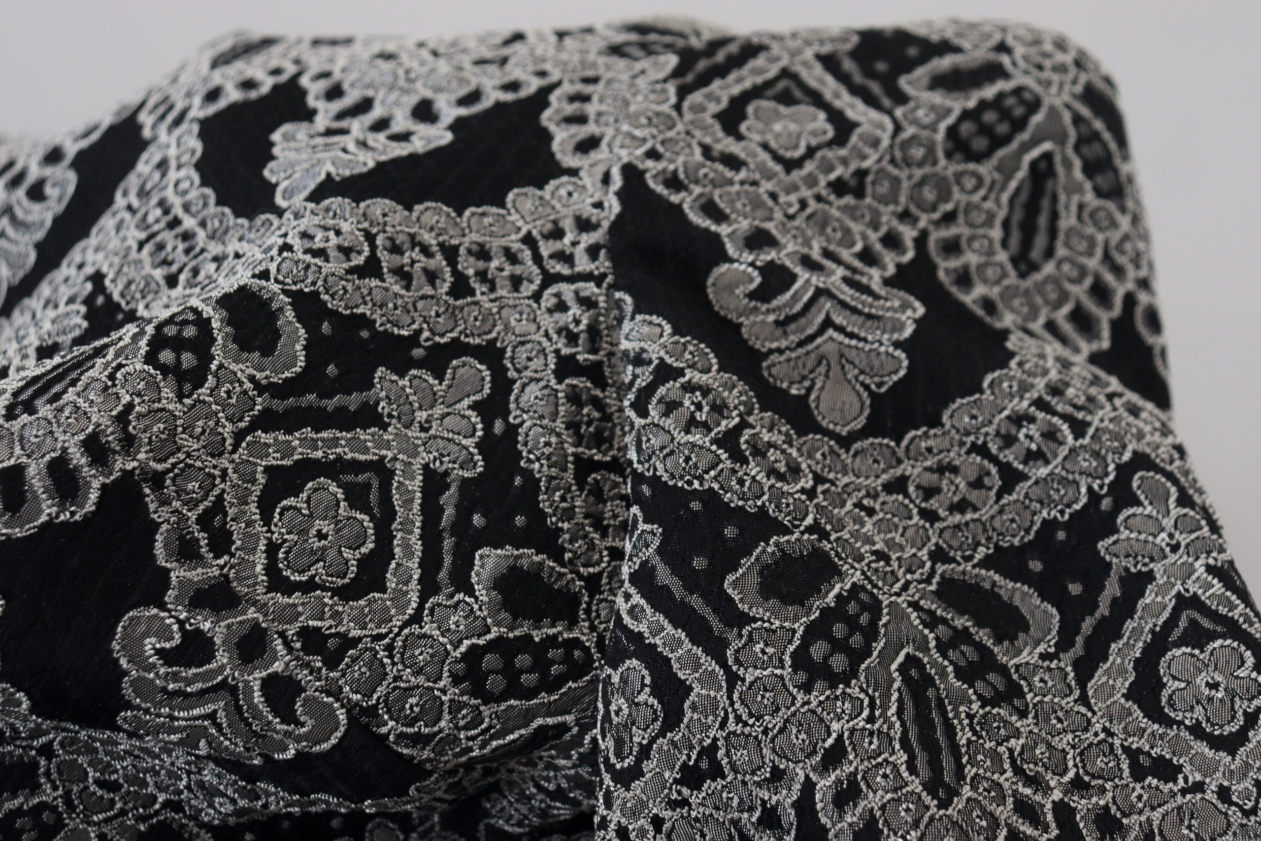 Black and gray jacquard sheath bodycon dress by Dolce & Gabbana, fitted design with intricate textured pattern.