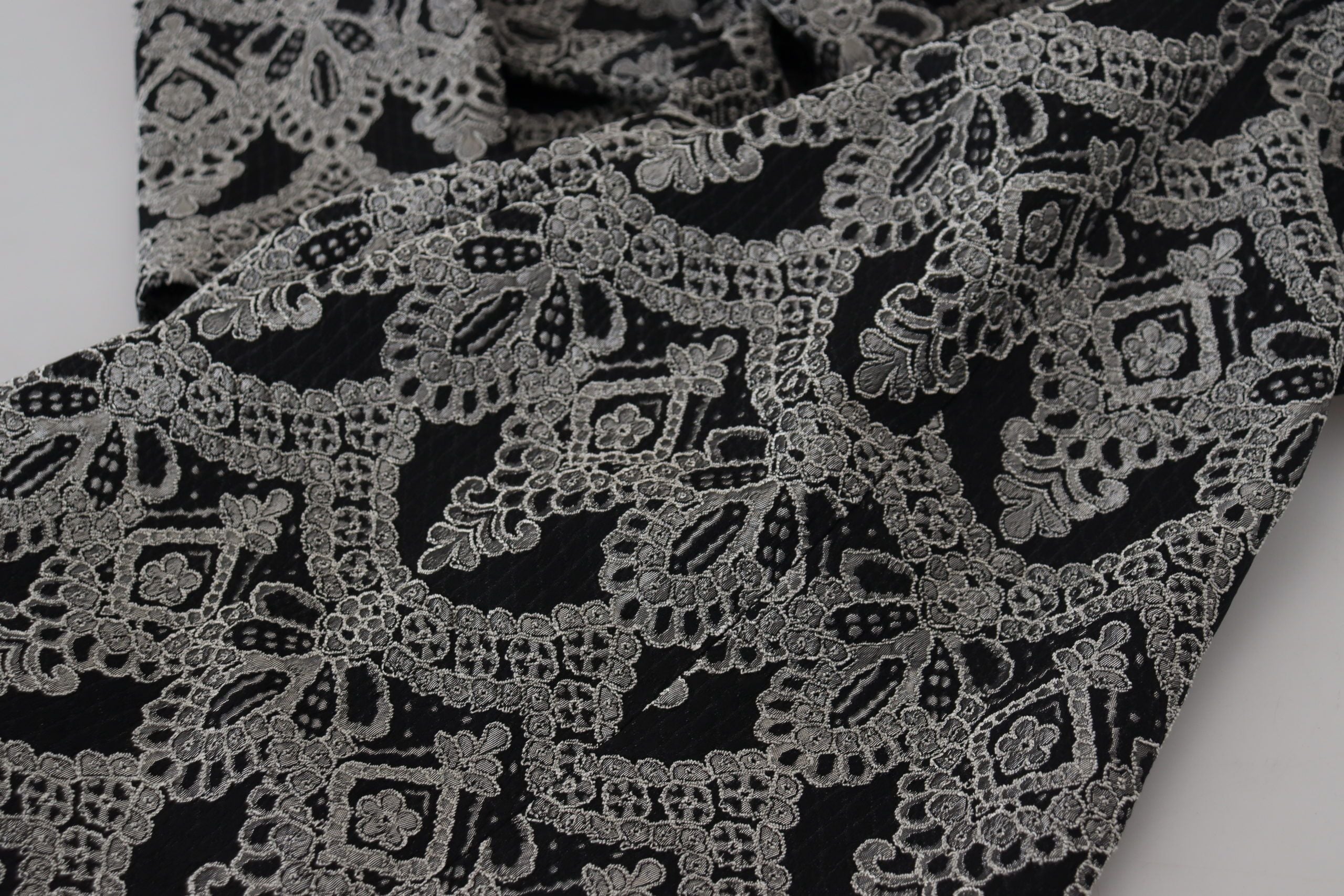 Black and gray jacquard sheath bodycon dress by Dolce & Gabbana, fitted design with intricate pattern and elegant style.
