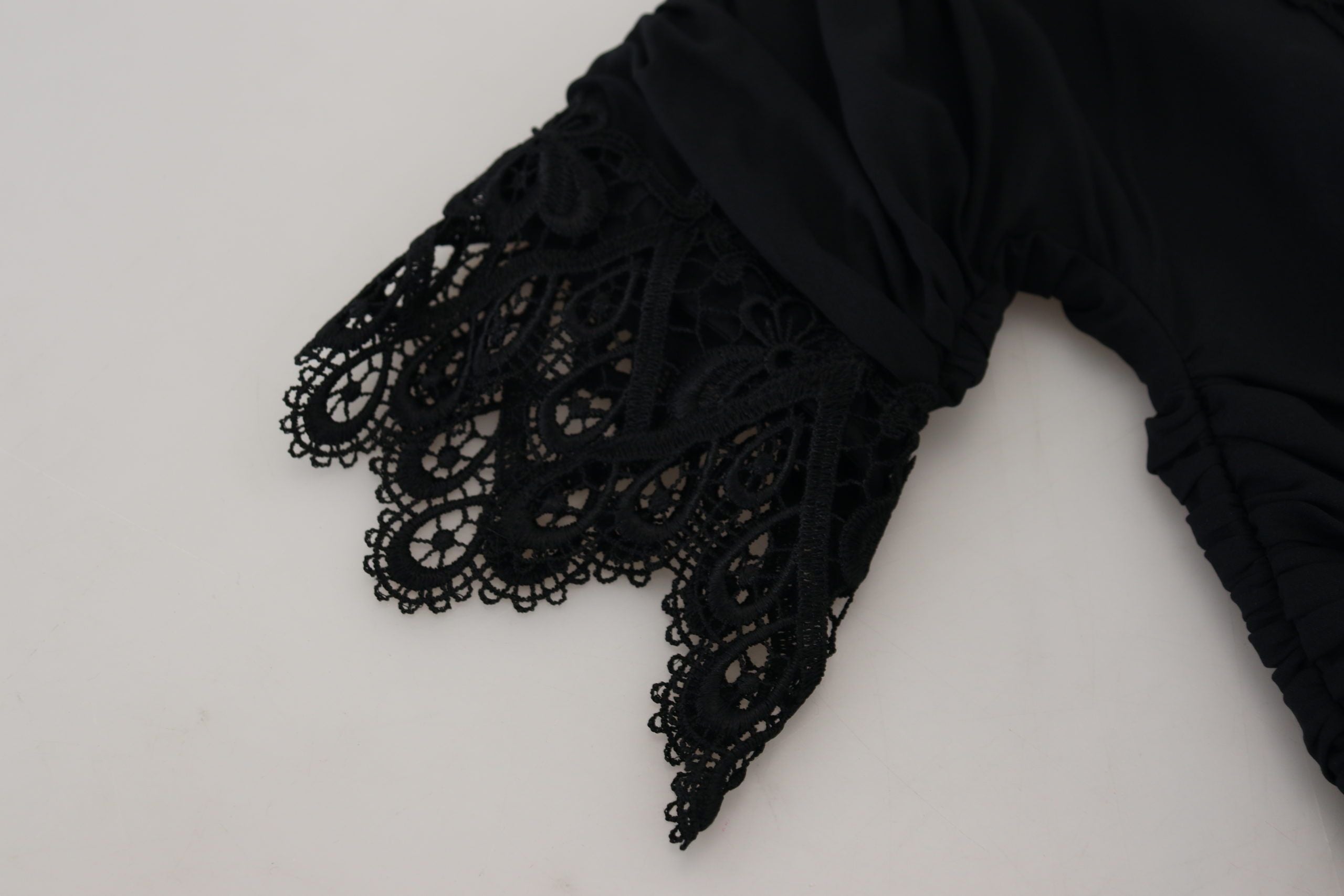 Black sheath midi bodycon lace silk dress by Dolce & Gabbana, showcasing fitted silhouette and intricate lace details.