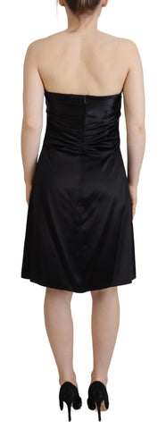 Black silk shift mini dress by Dolce & Gabbana, featuring a sleek short party dress design with elegant fabric and minimal detailing.