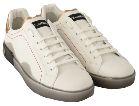 White gold leather low top sneakers by Dolce & Gabbana, casual shoes with sleek design and lace-up front.