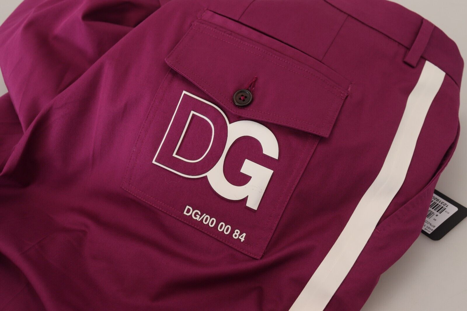 Magenta cotton Dolce & Gabbana logo pocket trouser pants with side pockets and belt loops, styled for casual wear.