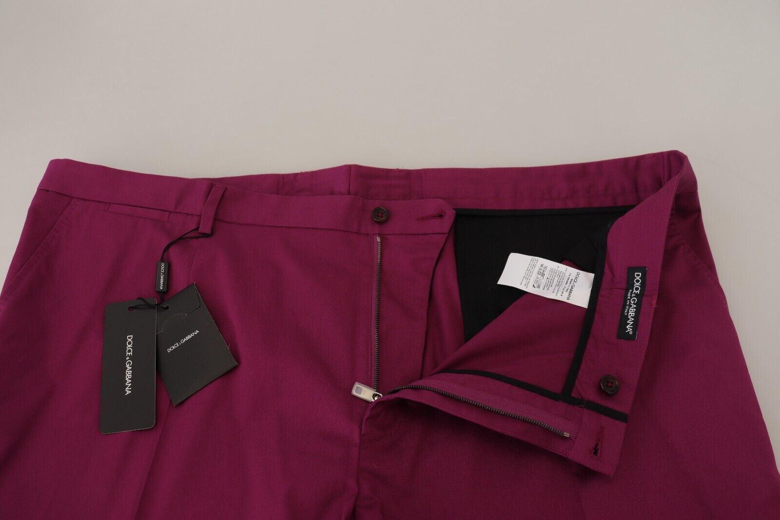 Magenta cotton Dolce & Gabbana logo pocket trouser pants with front pockets and fitted waist, stylish and casual.