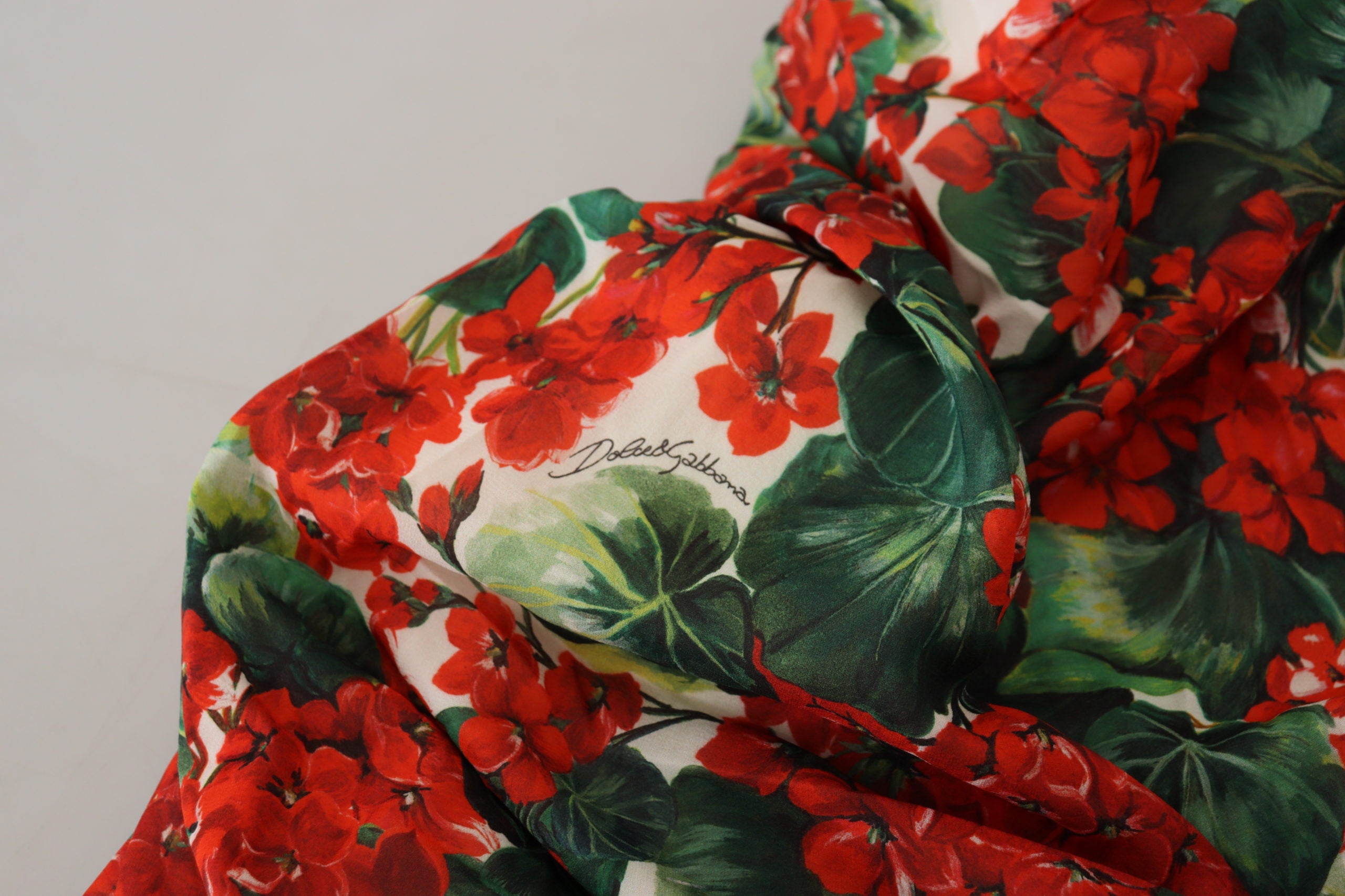 Multicolor silk sheath midi dress by Dolce & Gabbana featuring vibrant floral geranium pattern and elegant fit.