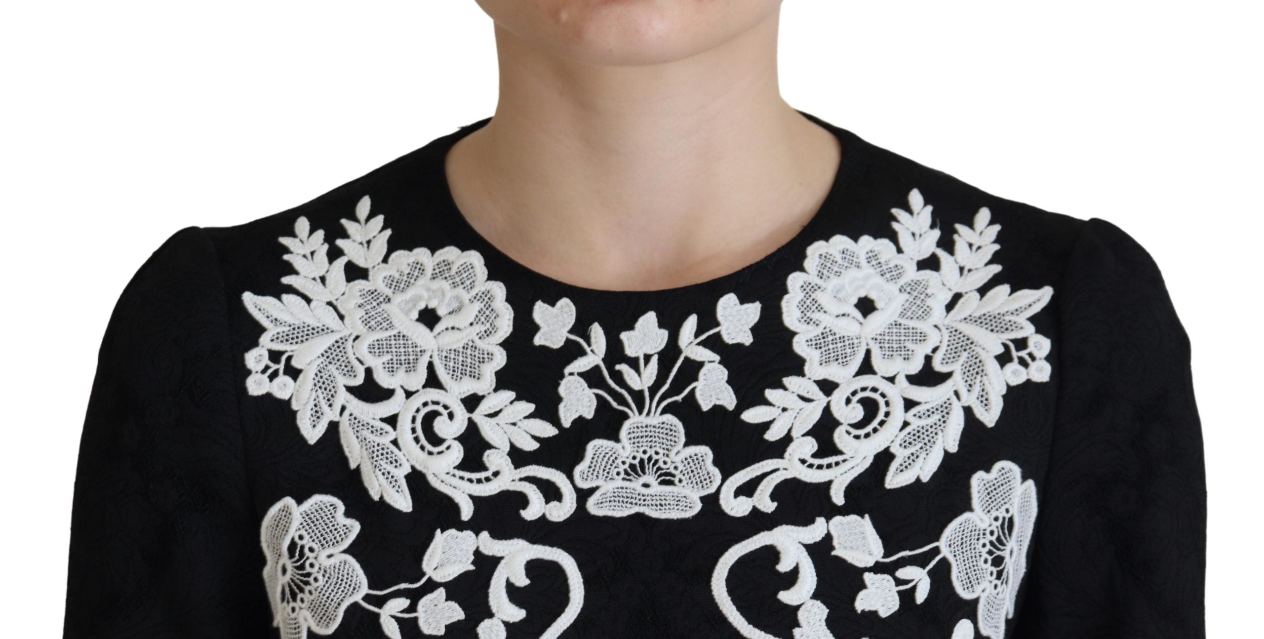 Black lace trim half sleeves Dolce & Gabbana A-line dress with elegant design and feminine silhouette.