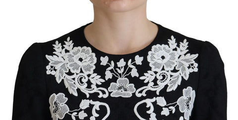 Black lace trim half sleeves Dolce & Gabbana A-line dress with elegant design and feminine silhouette.