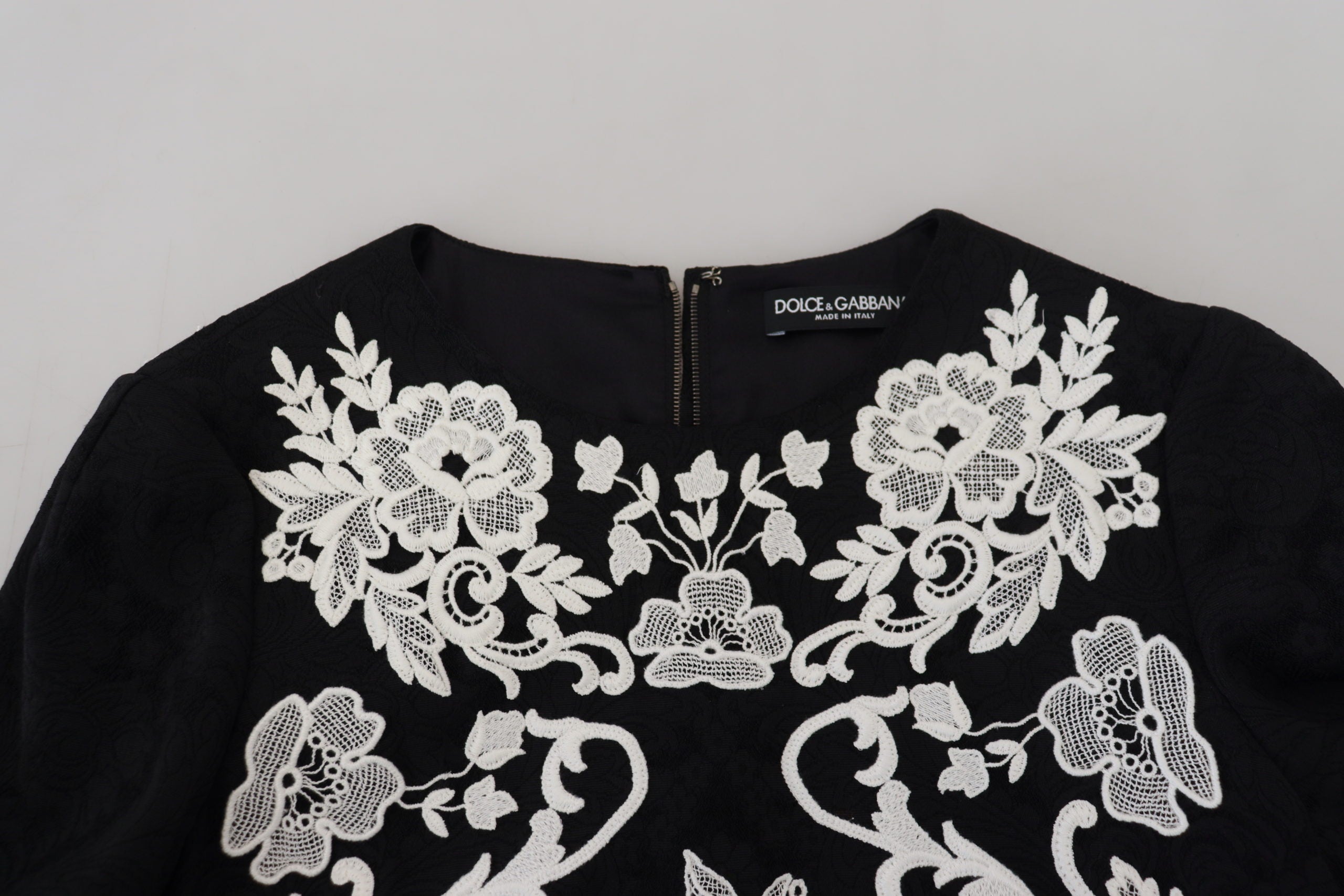 Black lace trim A-line dress with half sleeves by Dolce & Gabbana, featuring elegant lace details and a classic silhouette.