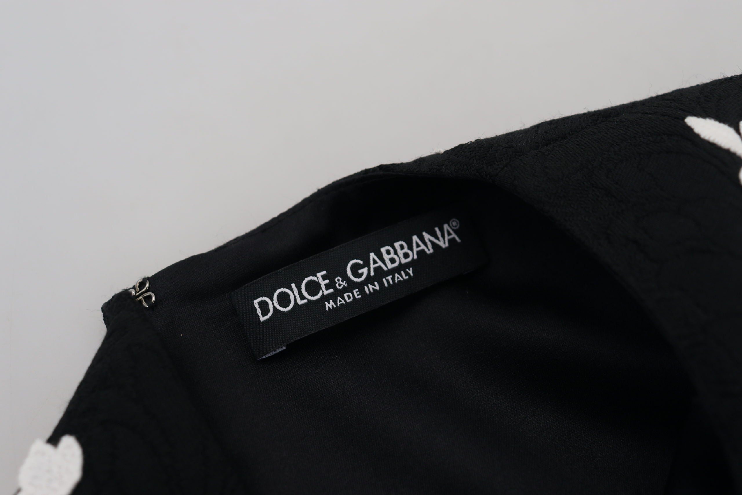 Black lace trim half sleeves A-line dress by Dolce & Gabbana, featuring a fitted bodice and flowing skirt.