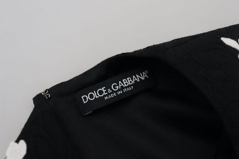 Black lace trim half sleeves A-line dress by Dolce & Gabbana, featuring a fitted bodice and flowing skirt.