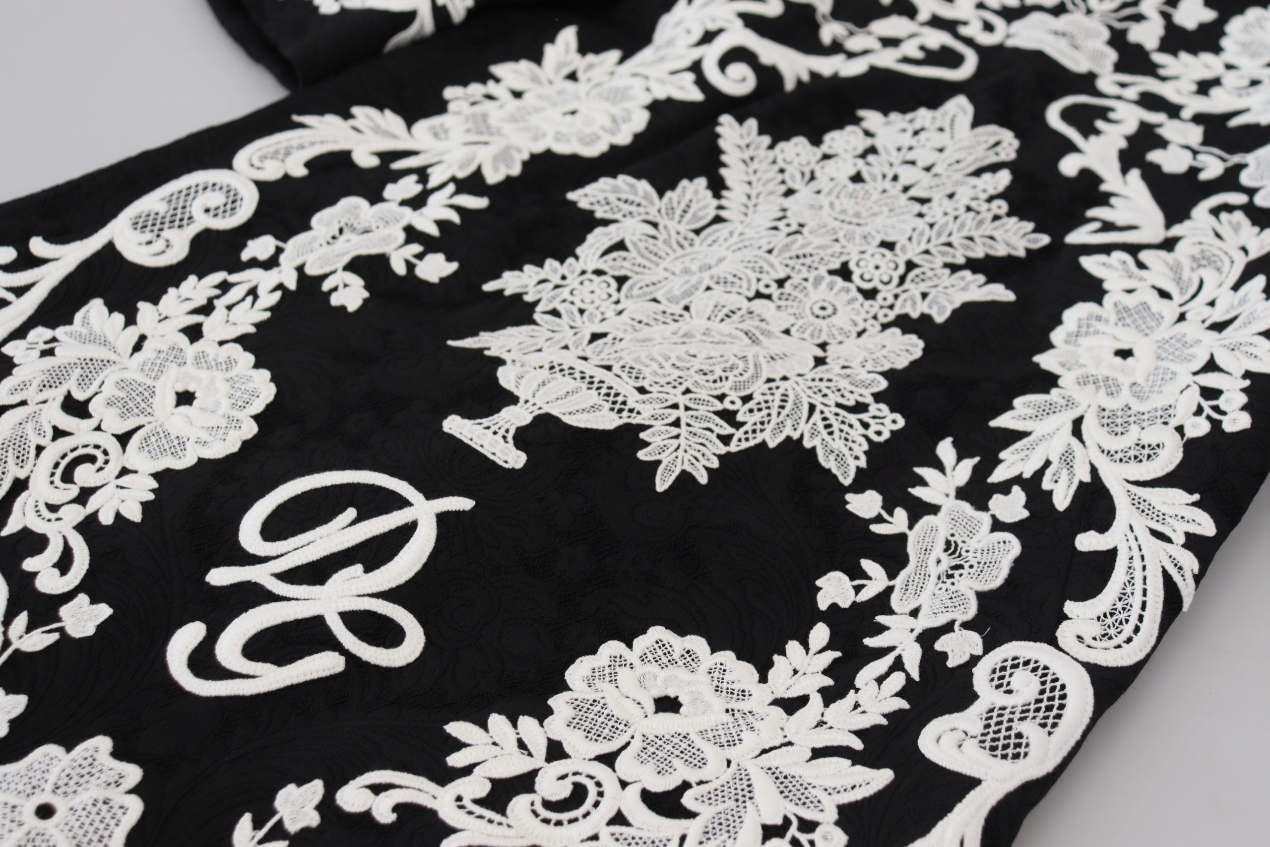 Black lace trim A-line dress with half sleeves by Dolce & Gabbana, featuring elegant lace details and a flattering silhouette.