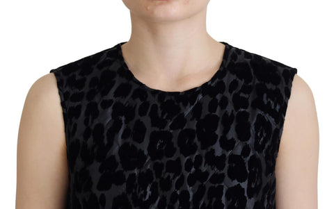 Black leopard print shift mini dress by Dolce & Gabbana, showing a fitted polyester dress with short sleeves and bold pattern.