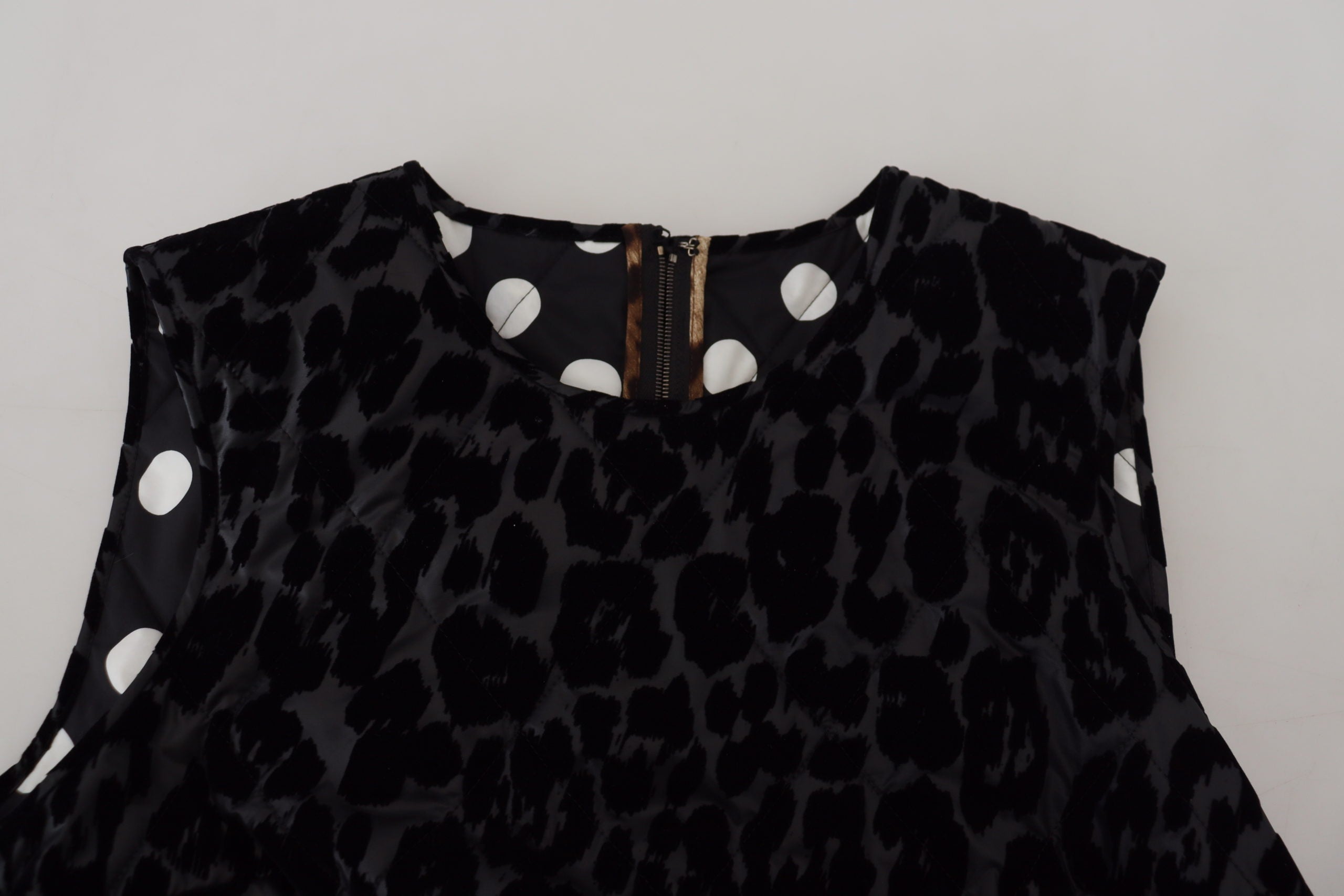 Black leopard print Dolce & Gabbana mini polyester shift dress displayed on a hanger.