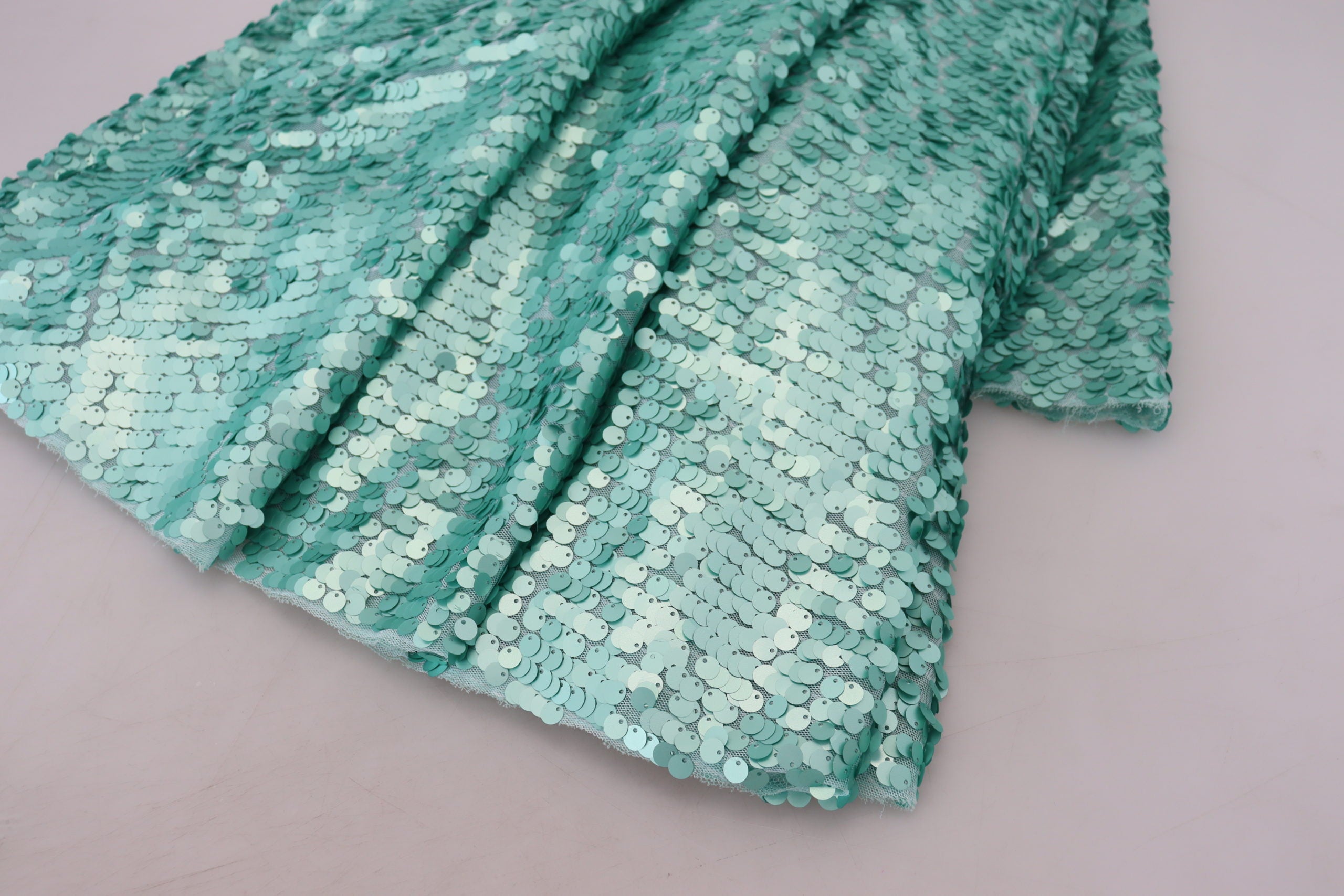 Blue sequined pleated A-line midi nylon dress by Dolce & Gabbana, featuring shimmering sequins and a flowing pleated design.
