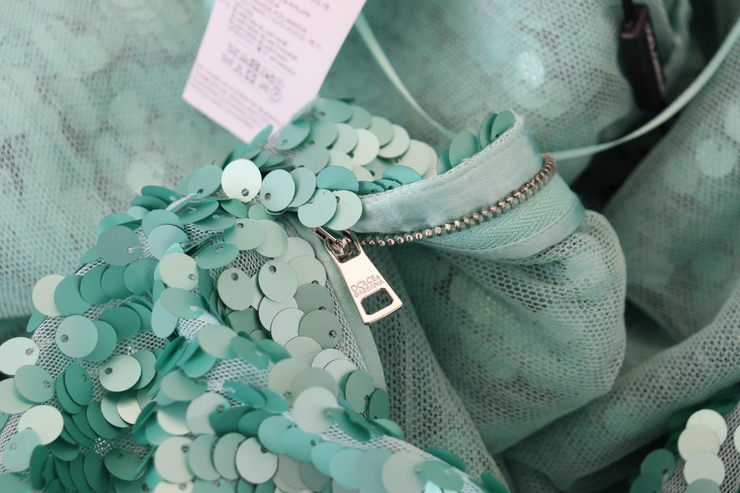 Blue sequined pleated A-line midi nylon dress by Dolce & Gabbana, featuring shimmering sequins and elegant pleats.