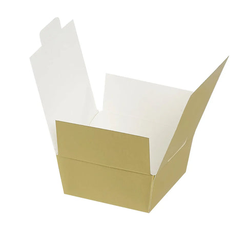 Four matte gold chocolate ballotins from Jag Couture London New York, elegant packaging for gifting chocolates.