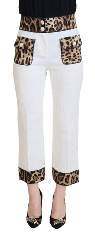 White leopard print high waist pants by Dolce & Gabbana, showcasing fitted design and stylish animal pattern.