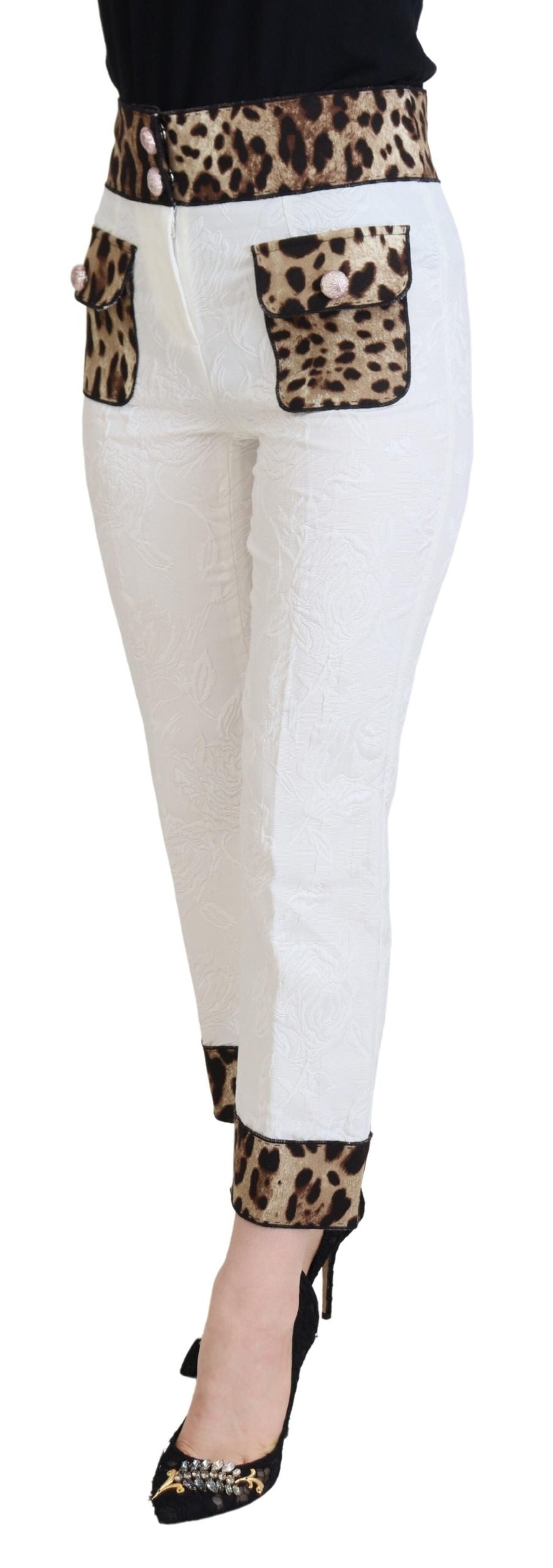 White leopard print high waist pants by Dolce & Gabbana, featuring fitted design and stylish pattern, shown on a model.