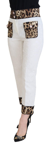 White leopard print high waist pants by Dolce & Gabbana, featuring fitted design and stylish pattern, shown on a model.