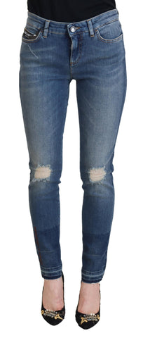 Blue washed cotton tattered denim jeans by Dolce Gabbana with distressed details and a relaxed fit.