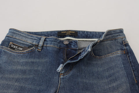 Blue washed cotton tattered denim jeans by Dolce & Gabbana with distressed details and relaxed fit.
