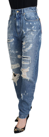 Blue washed cotton tattered denim jeans by Dolce & Gabbana, featuring distressed details and a relaxed fit.
