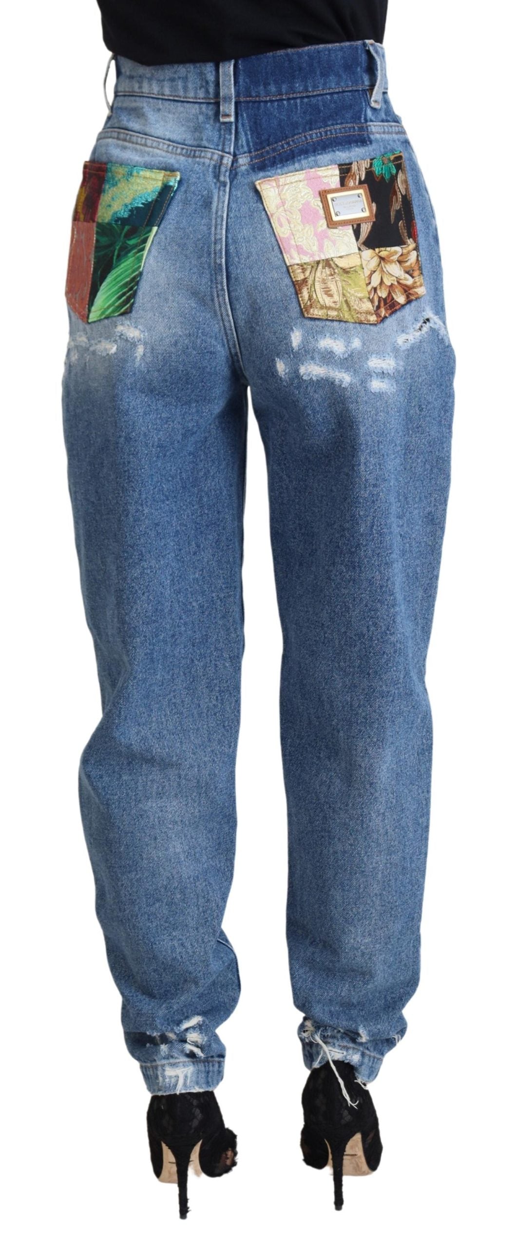 Blue washed cotton denim jeans with tattered details by Dolce & Gabbana, showing a relaxed fit and distressed style.
