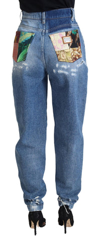 Blue washed cotton denim jeans with tattered details by Dolce & Gabbana, showing a relaxed fit and distressed style.