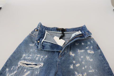 Blue washed cotton tattered denim jeans by Dolce & Gabbana, showing distressed details and classic five-pocket design.