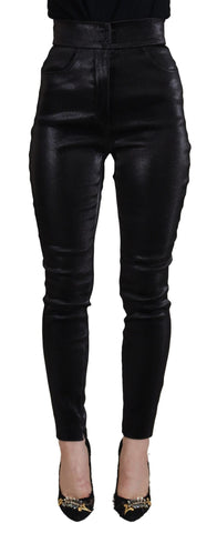 Black washed cotton skinny denim jeans by Dolce & Gabbana displayed on a model, showcasing the fitted style and classic wash.