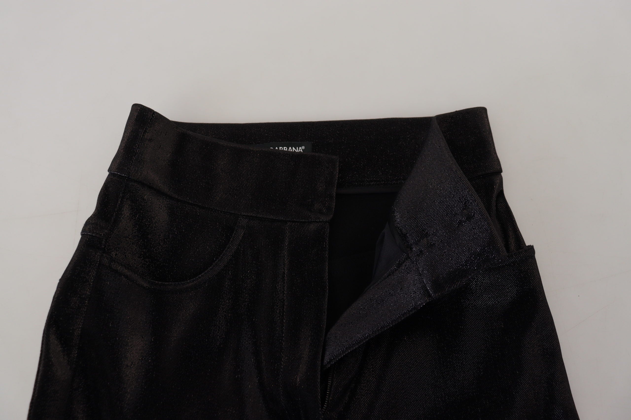 Black washed cotton skinny denim jeans by Dolce & Gabbana with classic five-pocket design and distressed detailing.