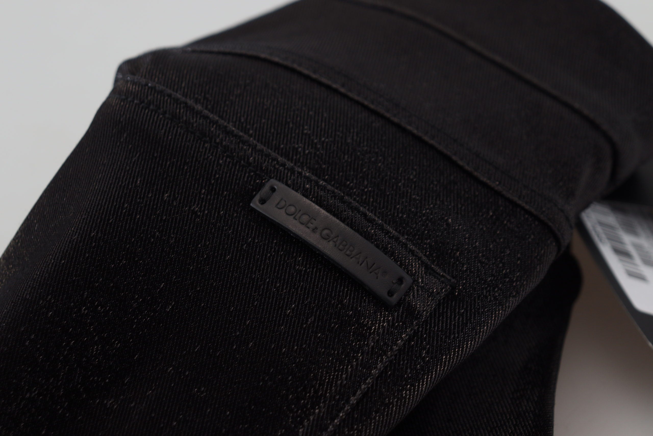 Black washed cotton skinny denim jeans by Dolce & Gabbana, showing fitted style and classic five-pocket design.