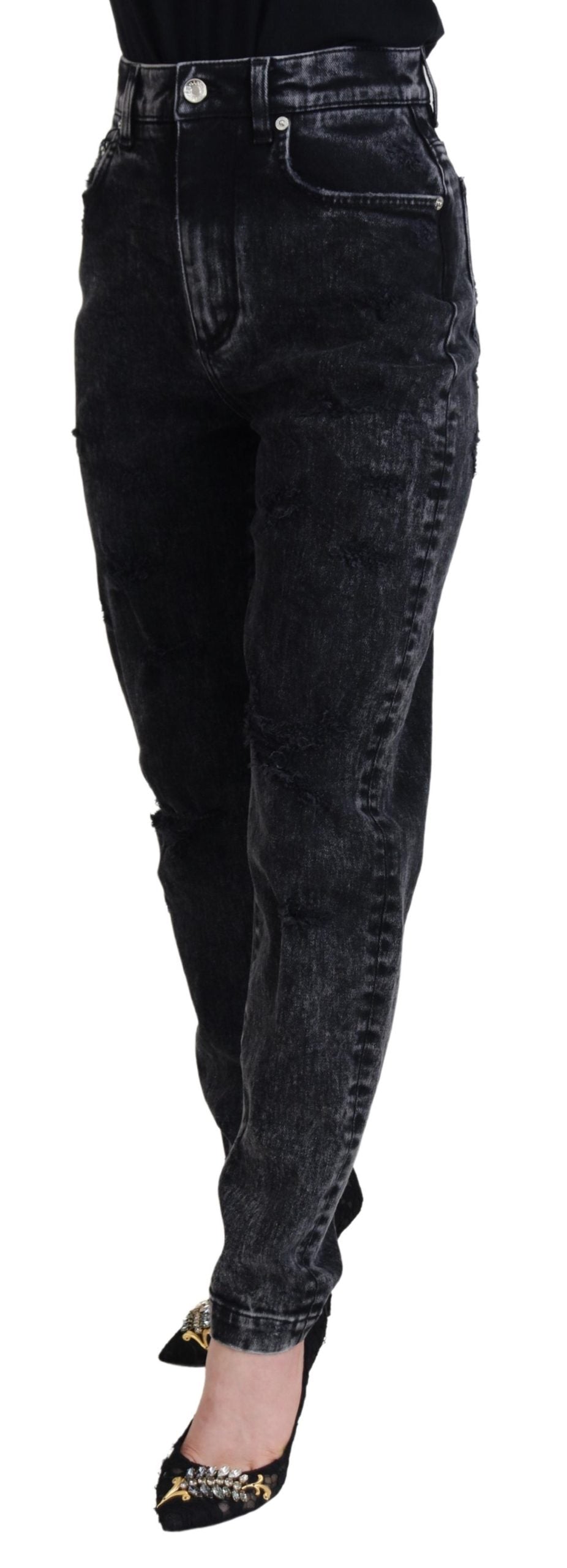 Black washed cotton high-waist denim jeans by Dolce & Gabbana, shown with a close-up of the fit and fabric texture.