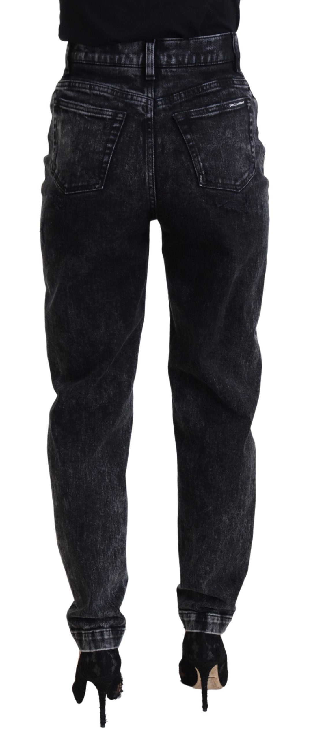 Black washed cotton high-waist denim jeans by Dolce & Gabbana, showing the fitted style and classic five-pocket design.