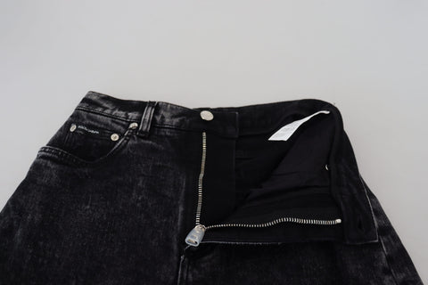 Black washed cotton high waist denim jeans by Dolce & Gabbana displayed on a hanger.