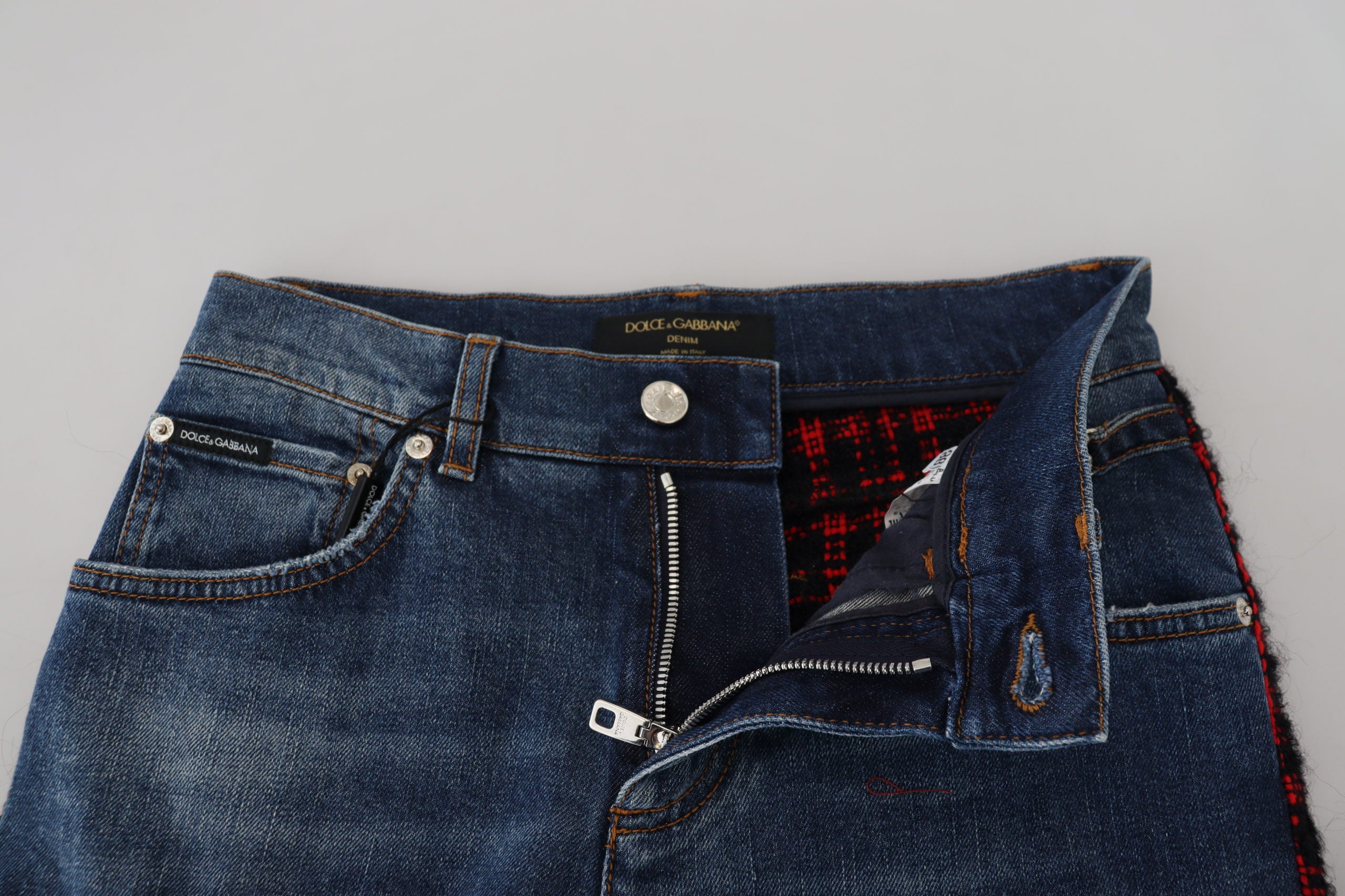 Blue checkered back skinny denim jeans by Dolce & Gabbana, featuring a fitted style and stylish checkered back pockets.