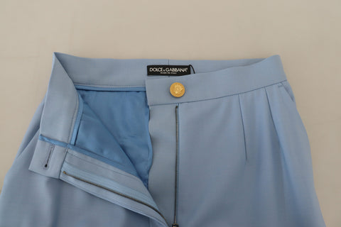 Light blue Dolce & Gabbana wide-leg pants with button details, featuring a relaxed fit and high-waisted design.