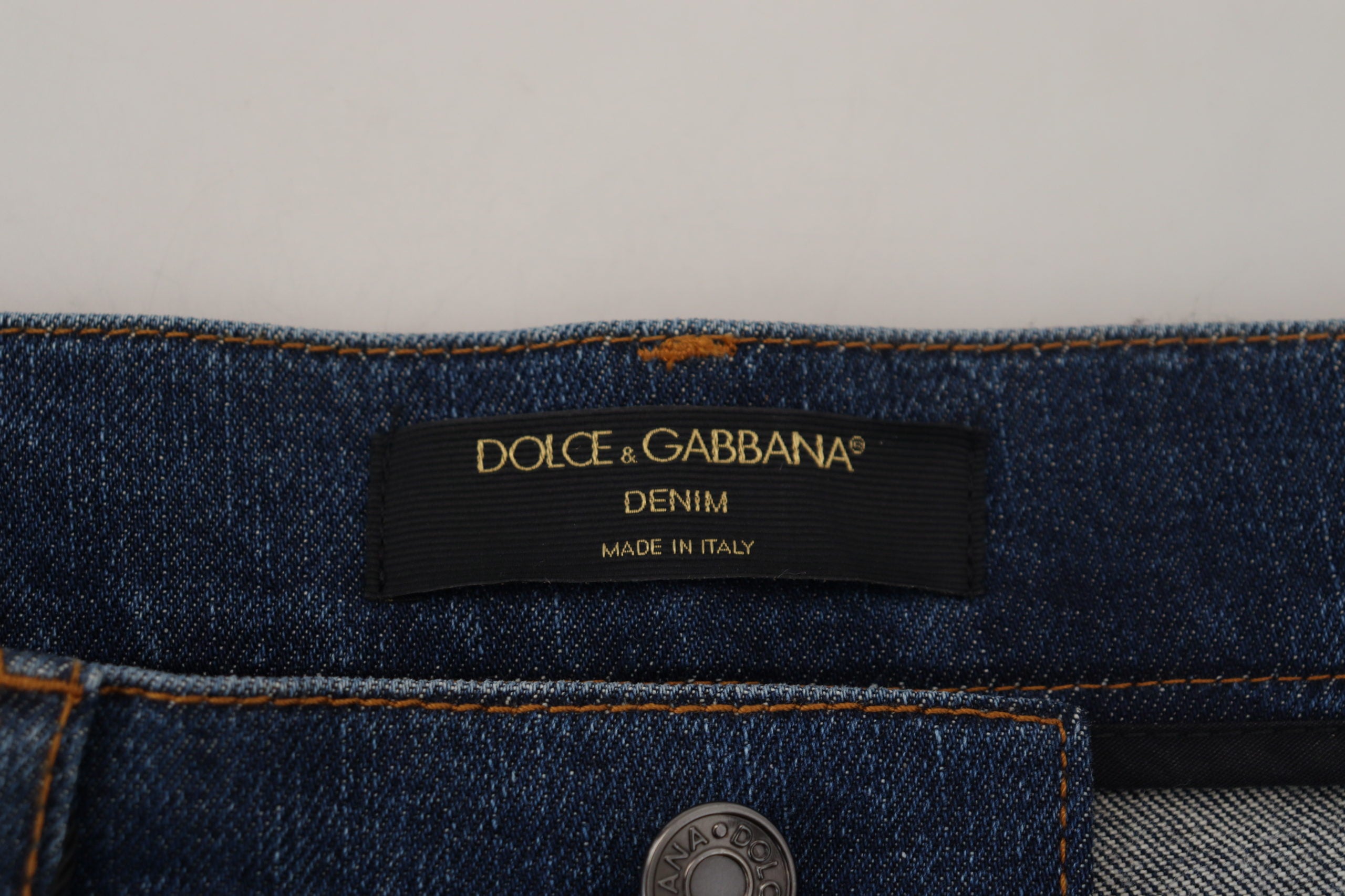 Black floral lace front skinny denim jeans by Dolce & Gabbana, showcasing lace details and a fitted denim silhouette.